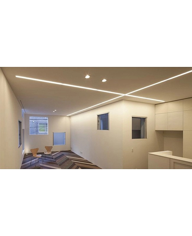 The LED strip channels with diffusers illuminate the ceiling