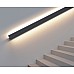 The black LED handrail lighting system is installed beside the staircase and offers upward and downward lighting to enhance aesthetics and safety.